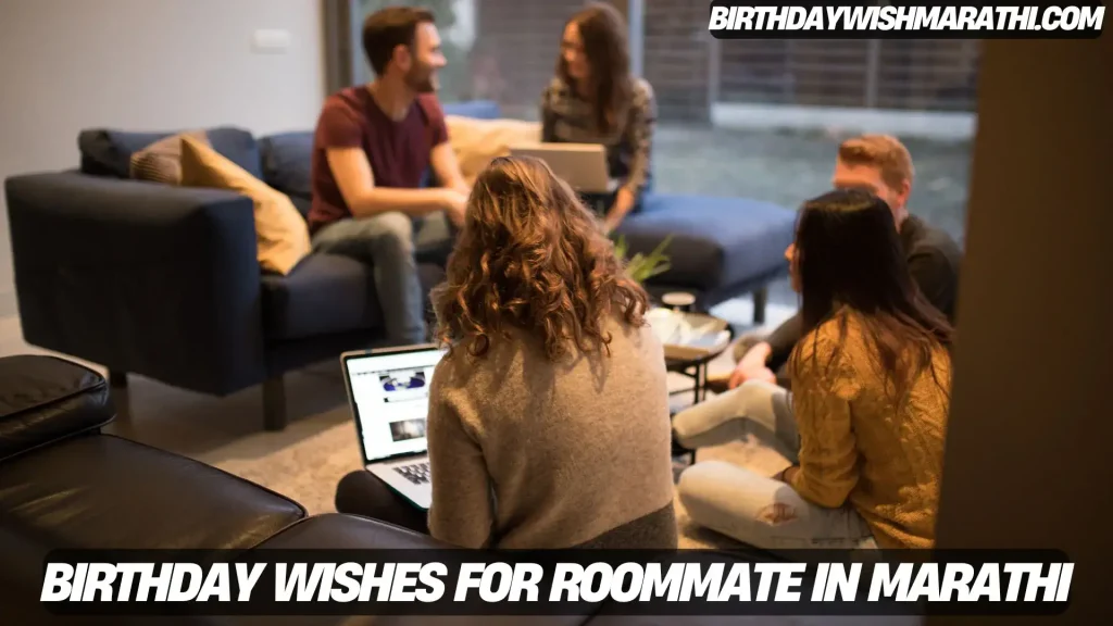 Group of friends, likely roommates, seated on a living room sofa, interacting and using laptops.